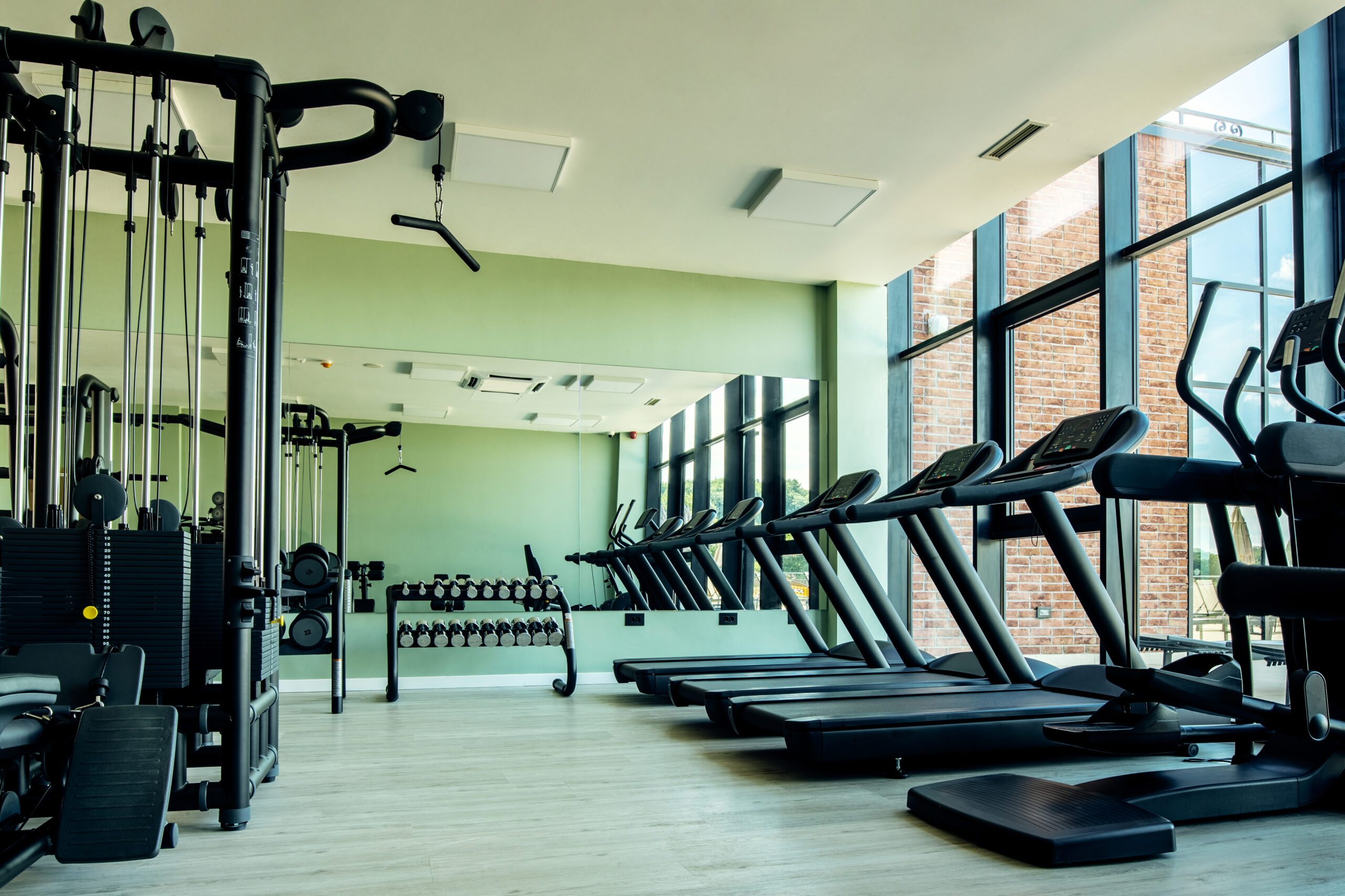 Gym with no people with exercises machines and equipment.